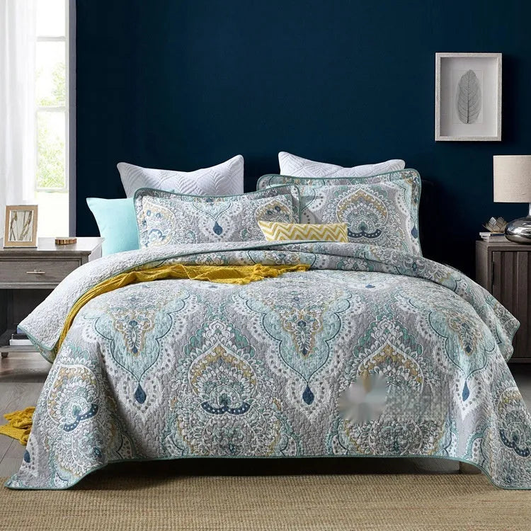 Quilted pure cotton bed cover set with printed pattern on bed, includes two pillowcases.