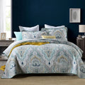 Quilted pure cotton bed cover set with printed pattern on bed, includes two pillowcases.