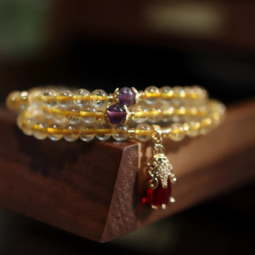 Natural Brazilian gold rutilated quartz bracelet with three gold beads and hanging chopsticks ornament