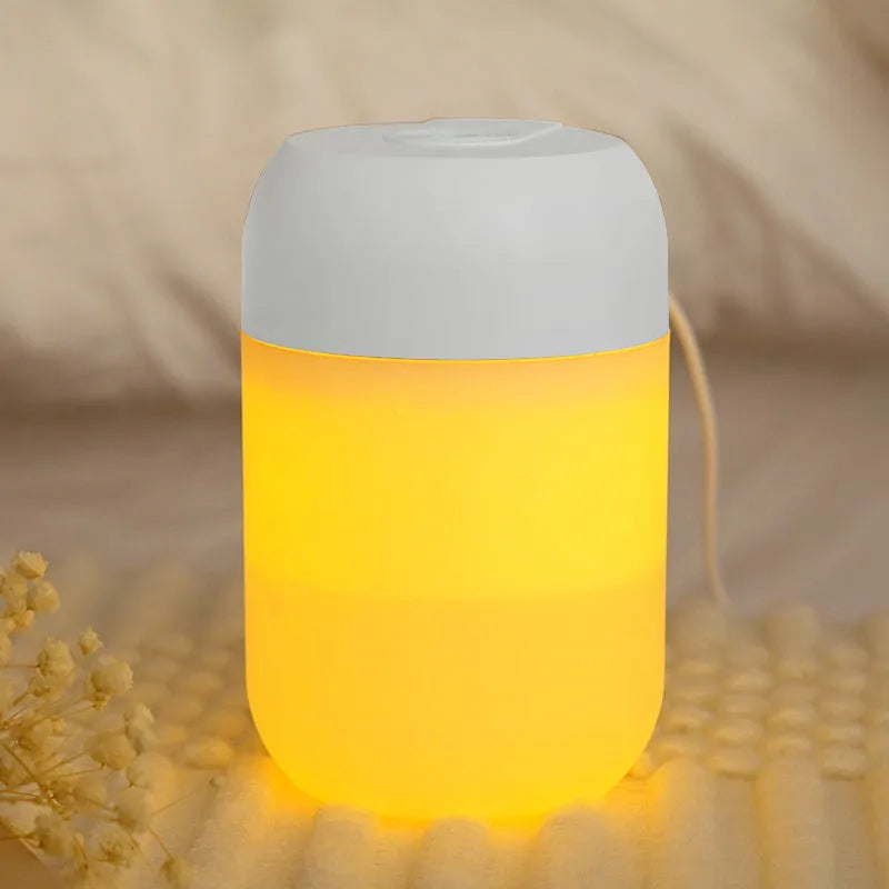 Small white cylindrical USB mini humidifier for desk or bedside use.