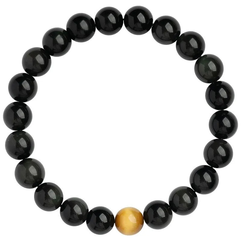 Black obsidian geometric bracelet with spherical beads on a wrist, showing unisex Korean style.
