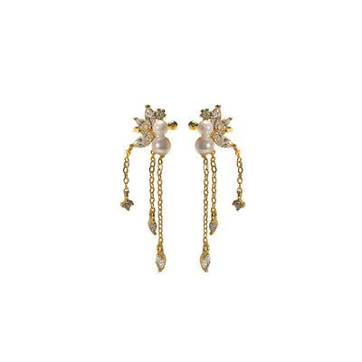 Pearl tassel ear clips in yellow gold or white gold colour with brass base and geometric shape
