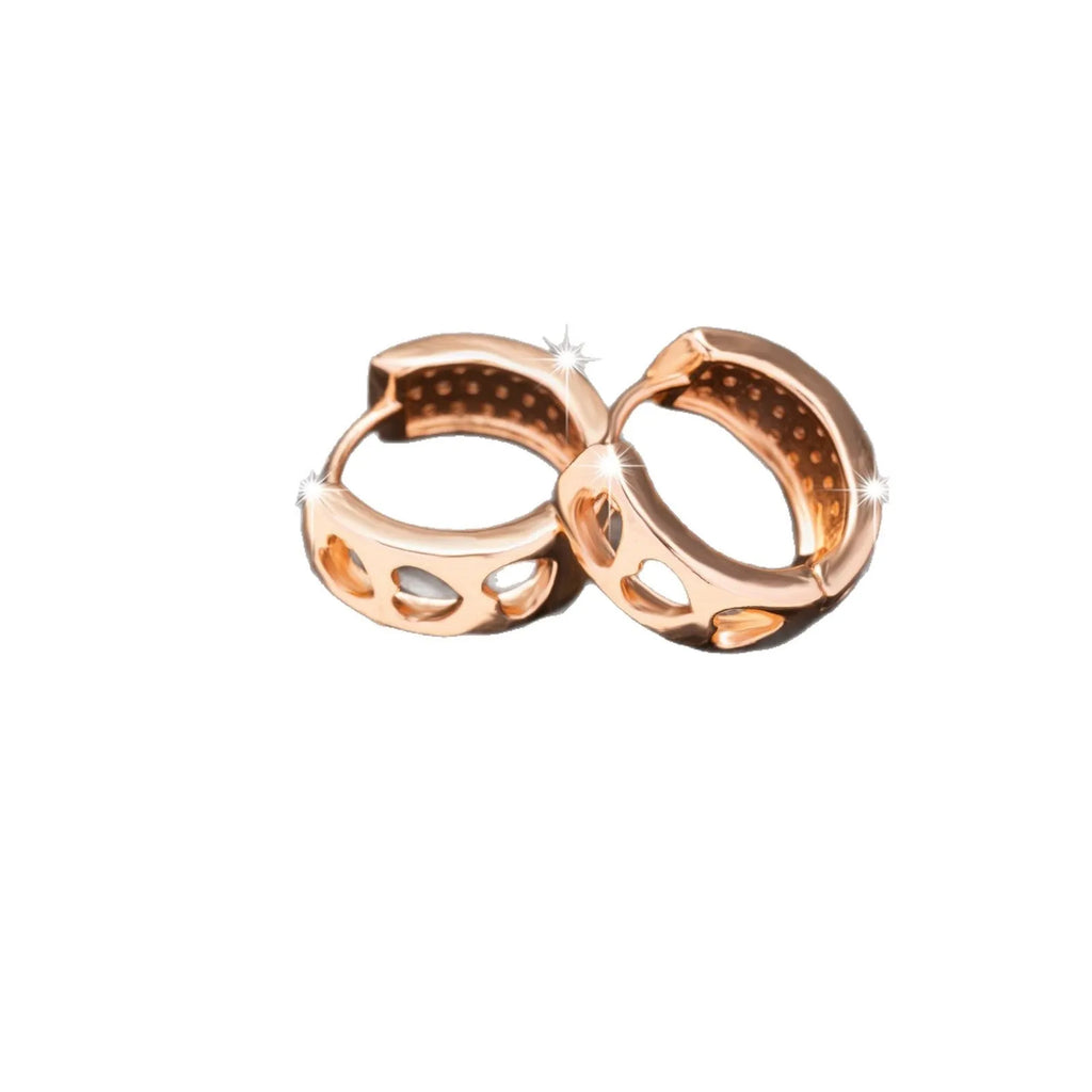 Rose gold circular earrings with three hollowed-out heart shapes.