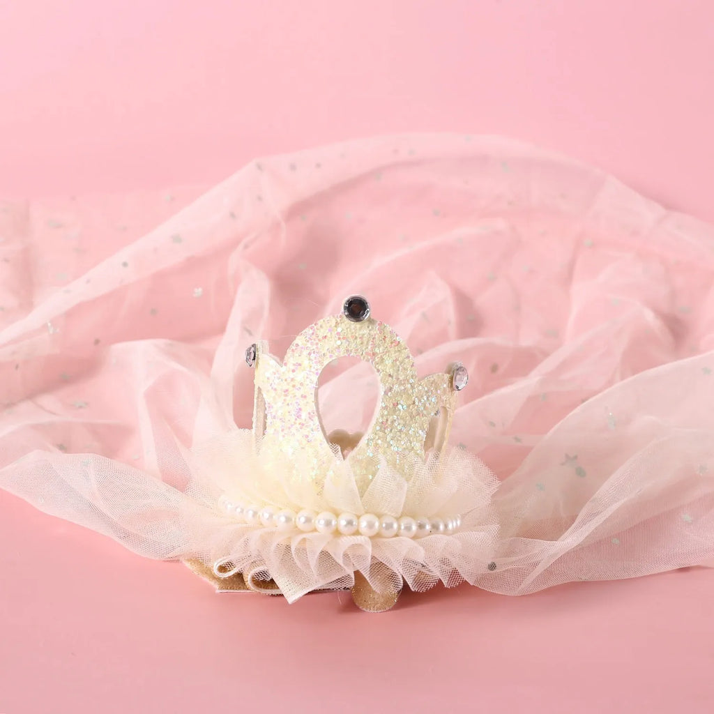 Pet cat wearing princess crown headdress with veil for wedding or birthday costume