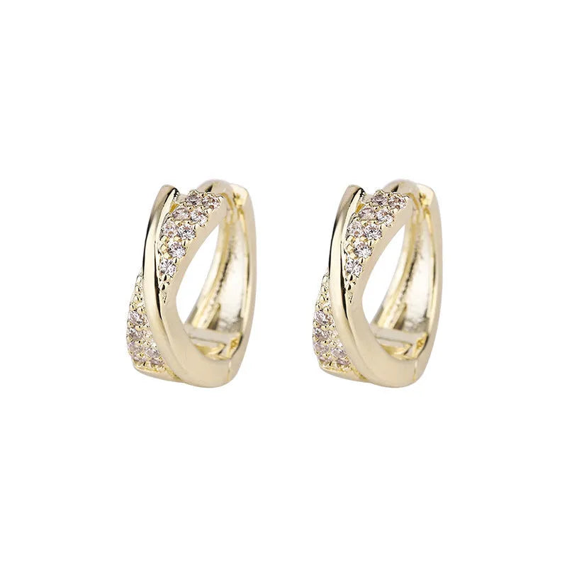 Geometric shaped women's earrings with 14K yellow gold plating and zircon stone details on a copper base.
