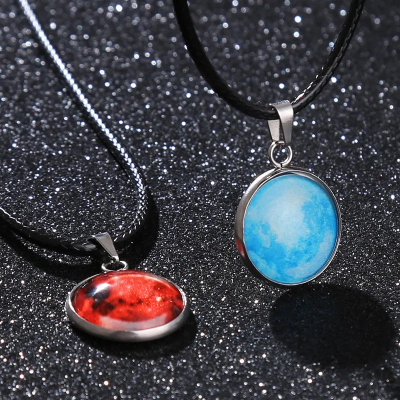 Luminous alloy necklace with a constellation-modelled glass pendant on an adjustable chain.