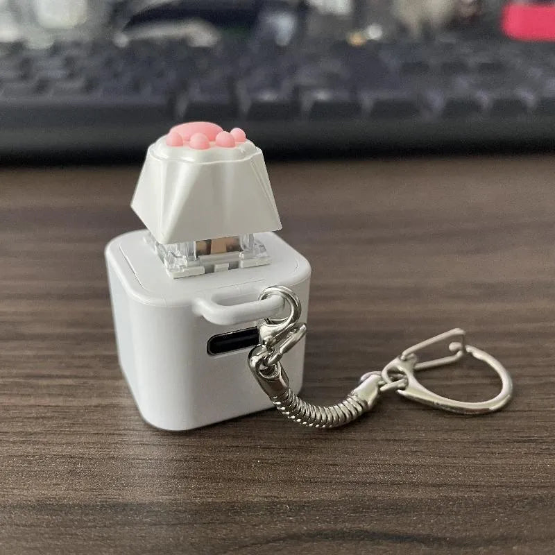 Decompression button keychain press sound toy with cat paw style, Type-C rechargeable, compact pendant design