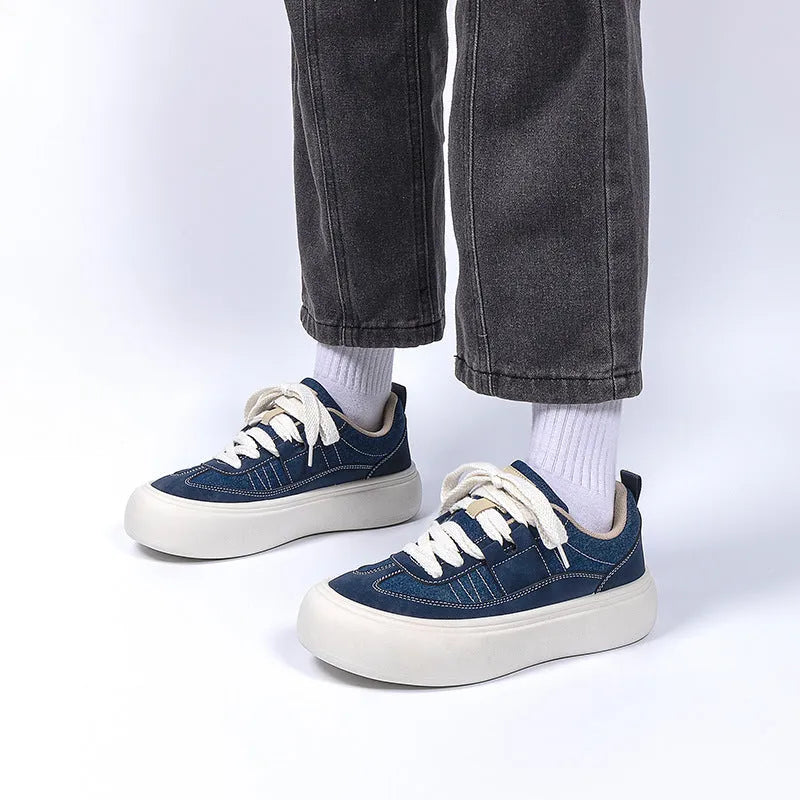 Men's low-top black canvas platform shoes with white raised sole and front lace-up.