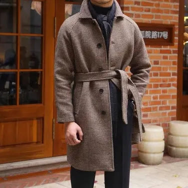 Mid-length brown wool coat with shoulder insert on a hanger, leisure style with structured shoulders
