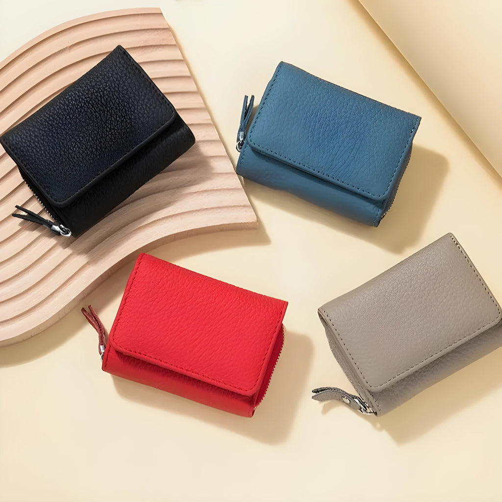 Women's leather tri-fold mini RFID wallet in elephant gray, 10x4x7.5cm, with sewing thread detailing