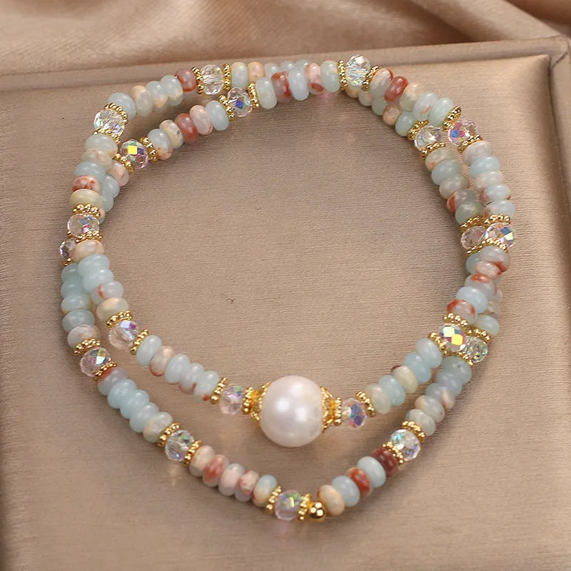 Natural colour Shoushan stone double circle bracelet with crystal one pearl on white background