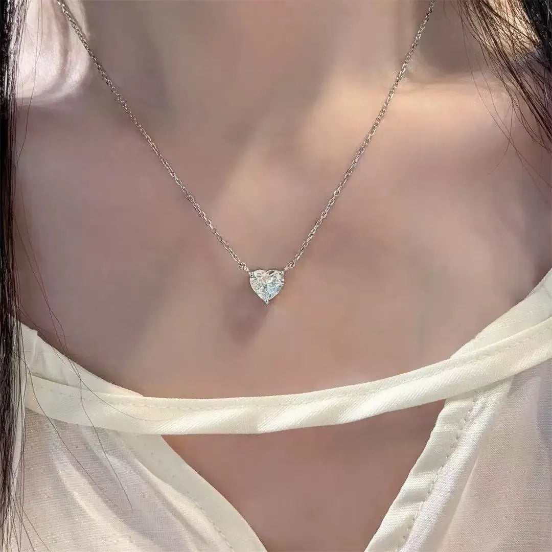 Women's silver-toned copper necklace with simple heart pendant on fine chain