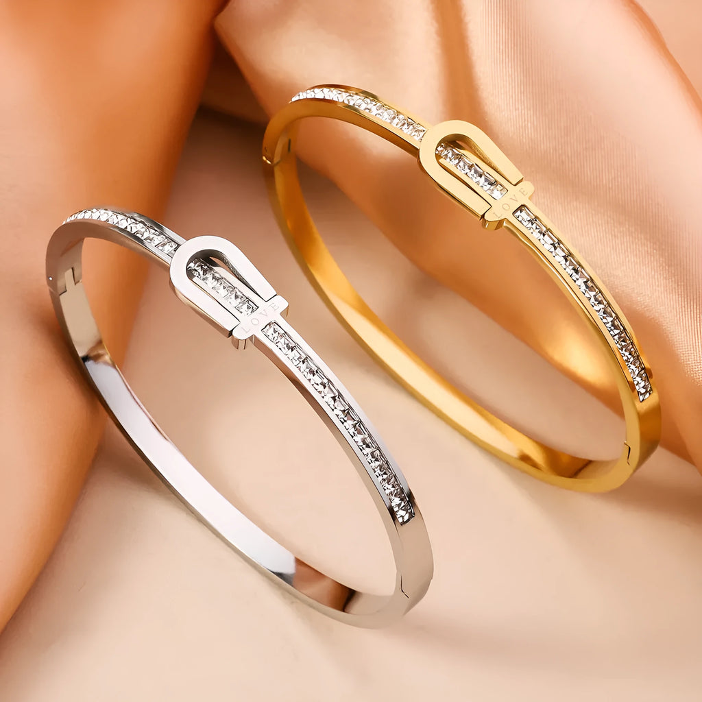 Gold plating titanium steel bracelet for women with electroplated finish, gold colour, on white background