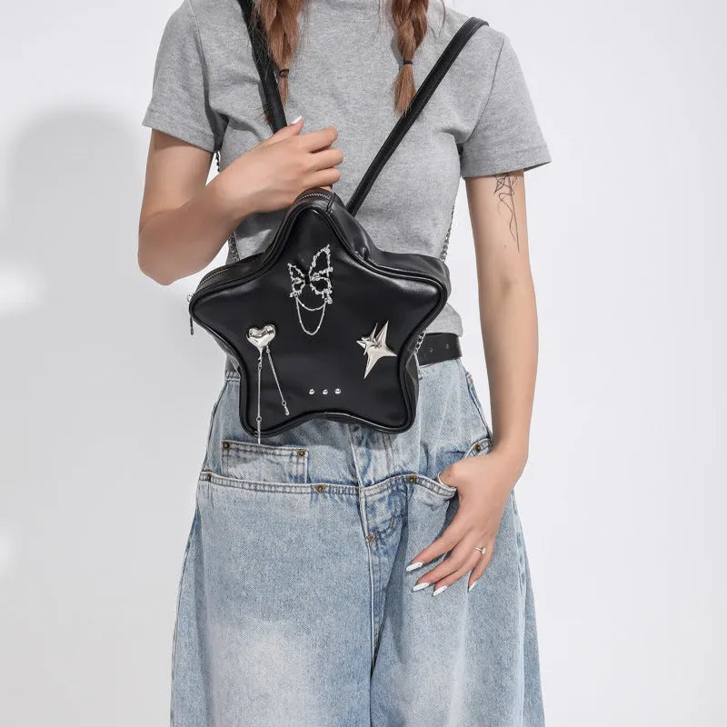 Black PU leather women's backpack with metal butterfly pendant charm and chain accents