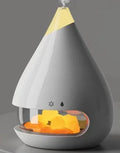 Square white ultrasonic humidifier and aromatherapy diffuser with colourful 3D flame light effect on a desk.