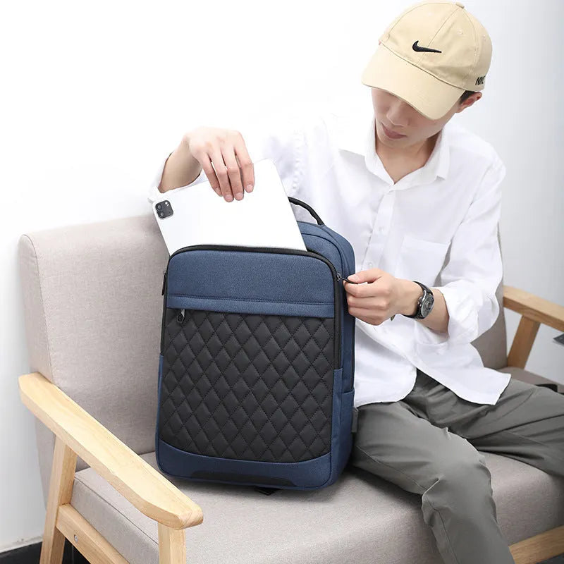 Men's solid colour Oxford cloth travel backpack with curved straps and diamond mesh detail, shown in grey.