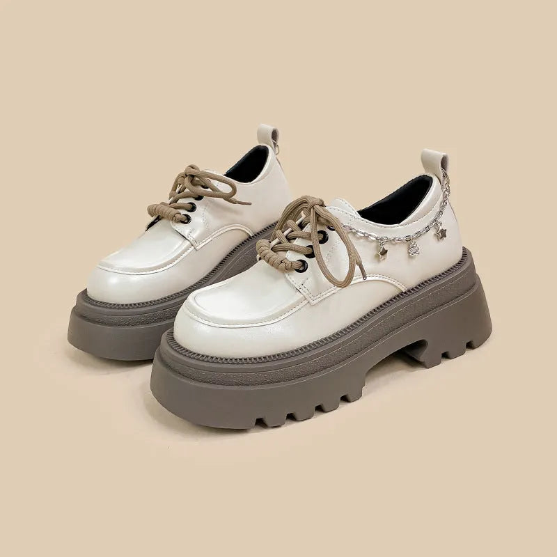 White women's platform Mary Jane shoes with round toe, front lace-up, and a chunky heel