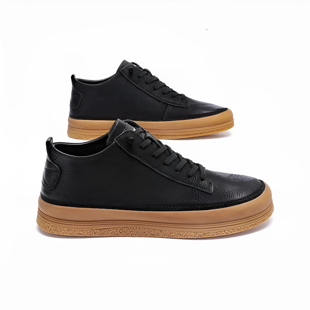 Men's black and white casual leather shoes with round toe and flat rubber sole.