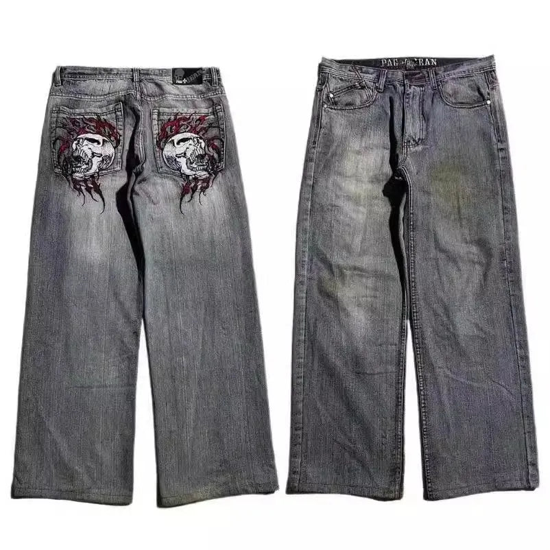 Gray washed-out denim jeans on a man, showing straight wide-leg cut and vintage workwear style.