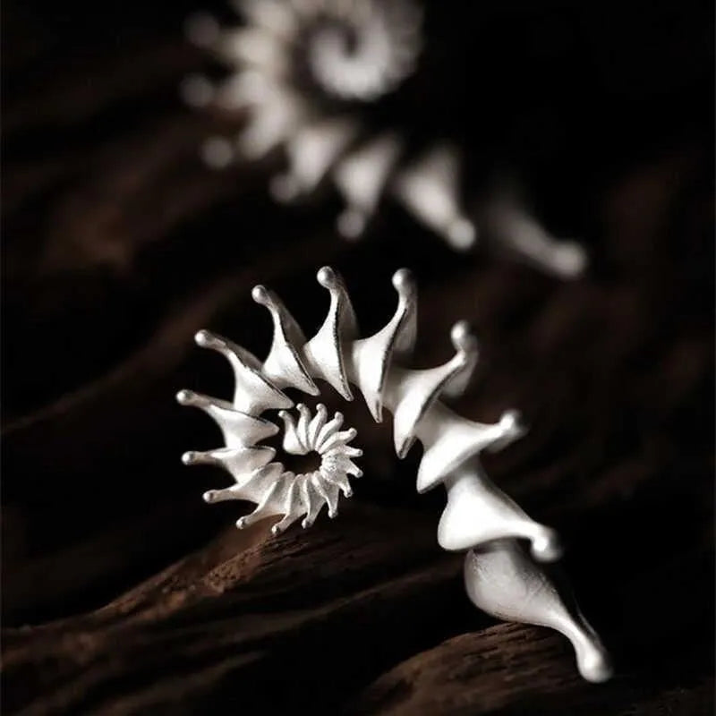 Three-dimensional matte conch shell stud earrings with electroplated alloy construction and irregular shape