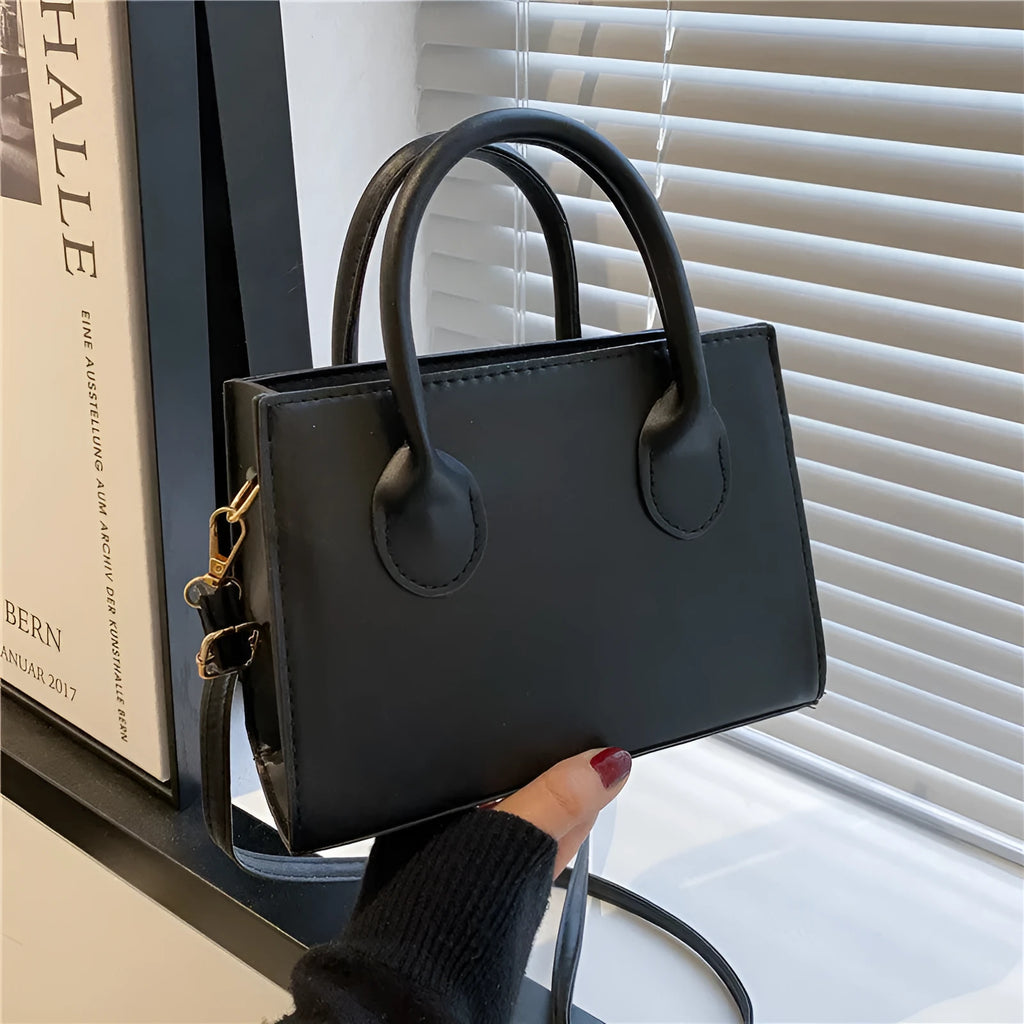 Women's black PU leather horizontal square shoulder bag with single strap and sewing line detailing