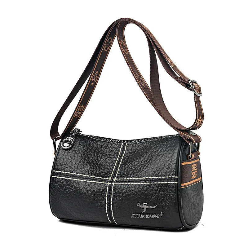 Genuine leather women's cylindrical shoulder bag with stitched patchwork, zip pocket, phone pocket and document pocket