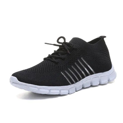 High-cut lace-up platform sneaker in a casual style with a breathable fabric upper and flat rubber sole.