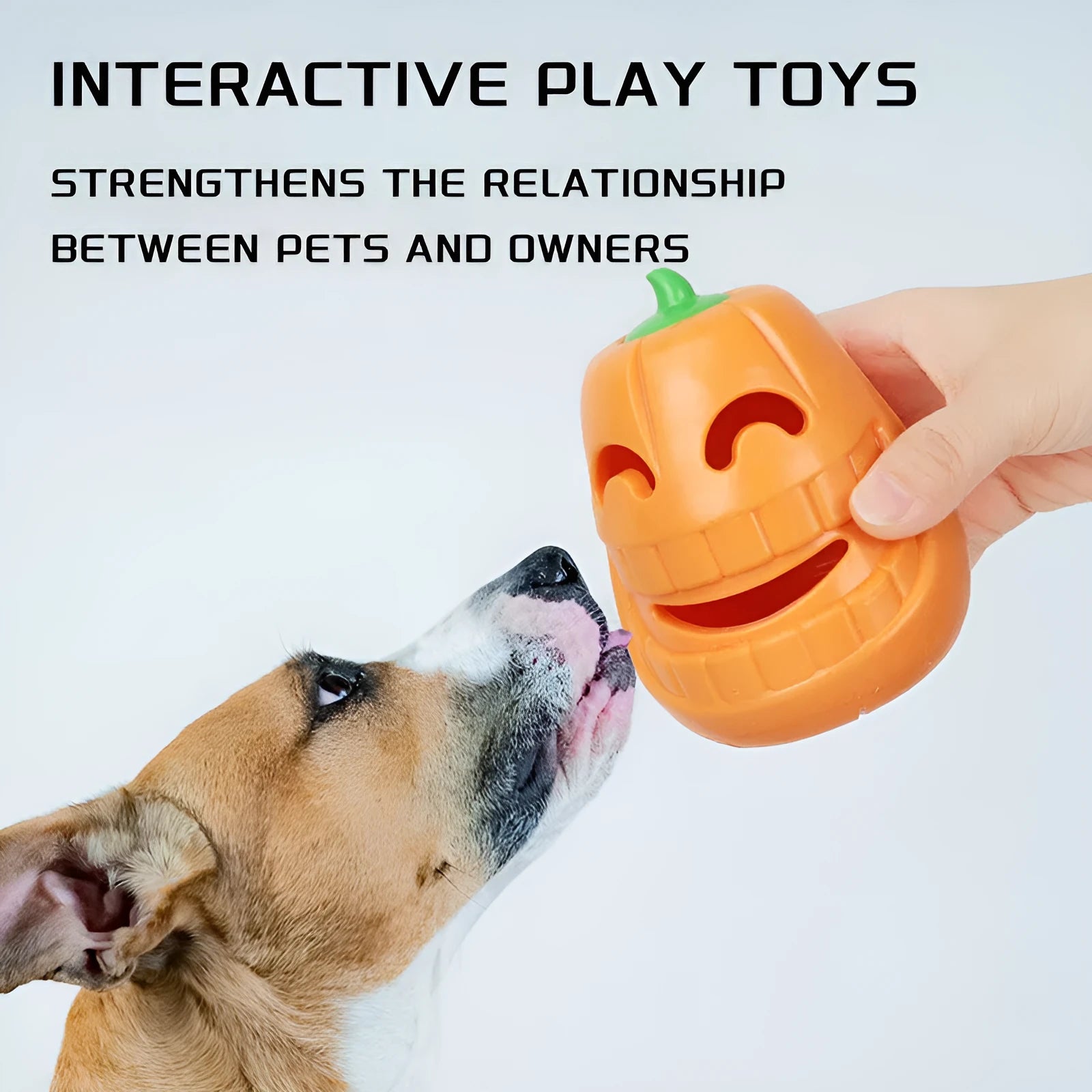 Orange Halloween pumpkin shaped durable thermoplastic rubber dog chew toy with a treat-dispensing funnel.