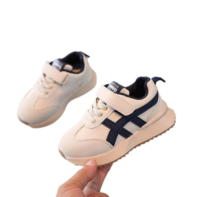Children's white synthetic leather sneaker with Velcro strap and rubber sole