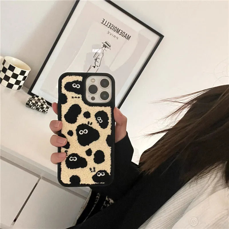 Black plush soft fairy design phone case for iPhone models.