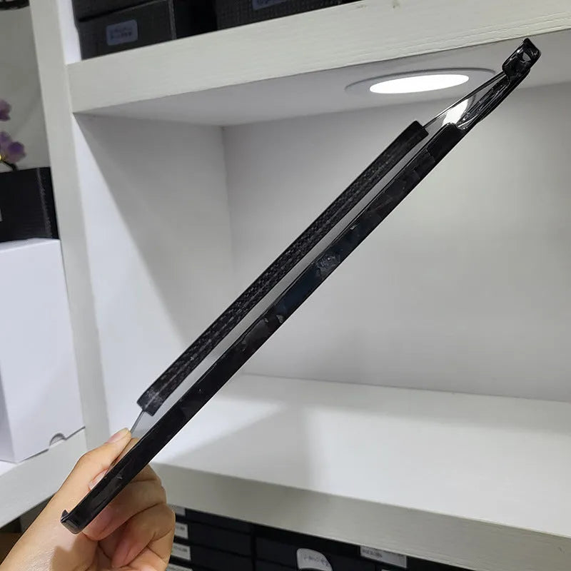 Flat carbon fibre hard protective case for Apple iPad Pro 11 tablet in a textured finish.