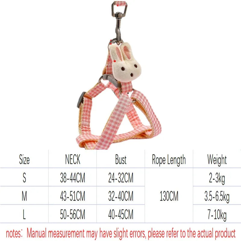 Blue quick-release anti-pull harness and leash set for a small dog on a walk.