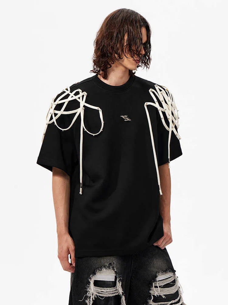 Black loose fit short-sleeved T-shirt with padded shoulders and rivet ribbon trim.