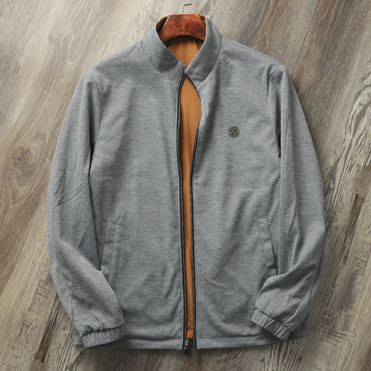 Man wearing a simple stand collar casual jacket in army green, showing the regular fit and cotton lining.
