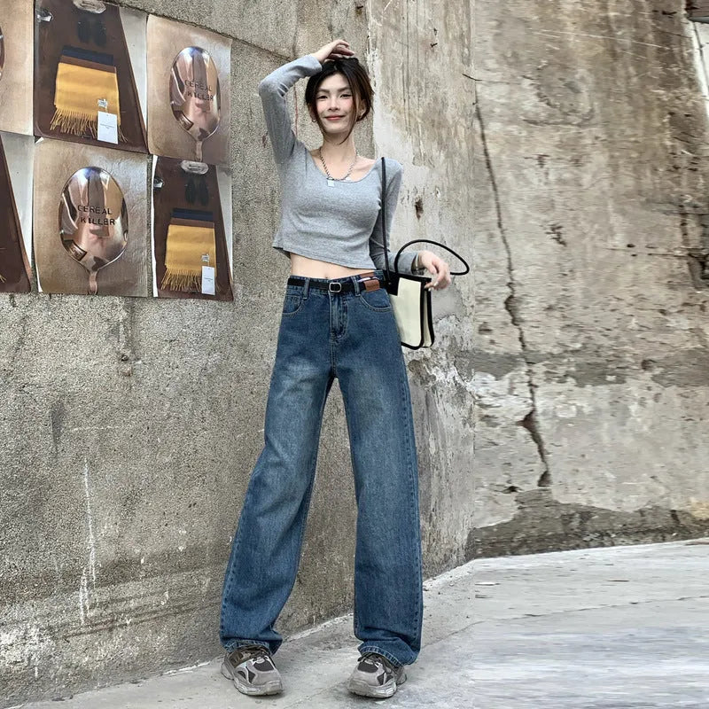 Women's high-waist retro blue straight-leg jeans on a model, showing the cropped, standard, and lengthened leg options.
