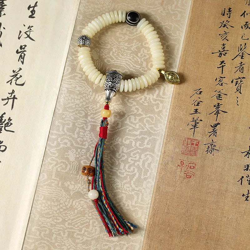 White Bodhi bead bracelet with 3 × 10mm beads in Tibetan style