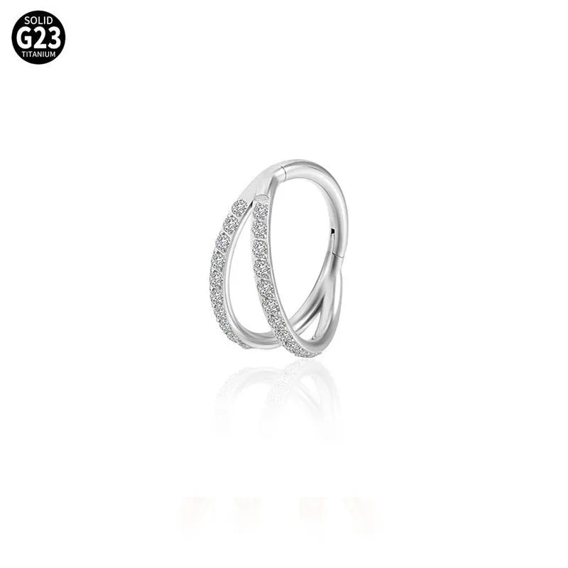 Close-up of a G23 titanium alloy lip ring with a diamond zircon finish in gold colour.