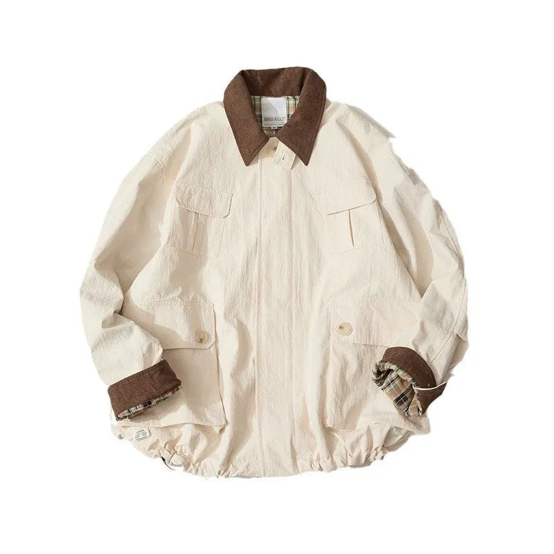 Green and apricot contrast colour casual jacket with side seam pockets on a hanger