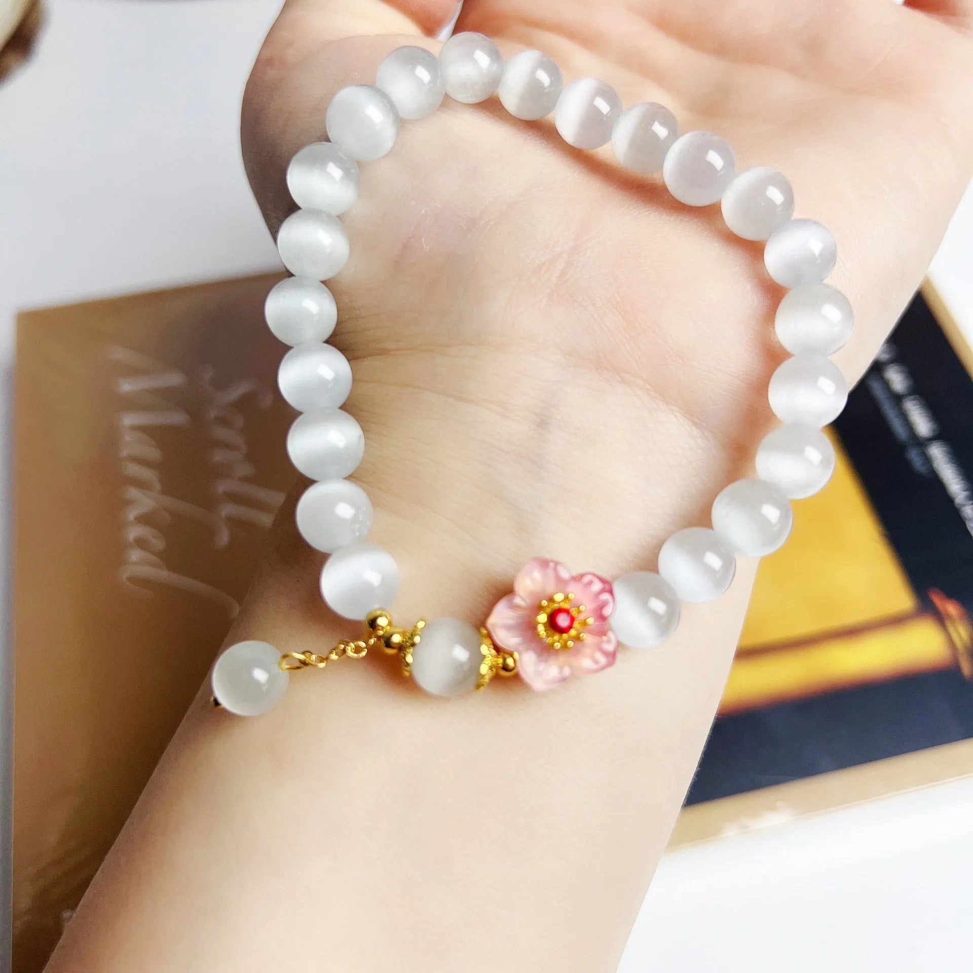 White opal flower beaded bracelet with colourful glaze accents on glass beads.