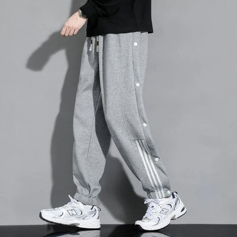 Men's loose black sweatpants with ankle ties and high elastic waistband for sports