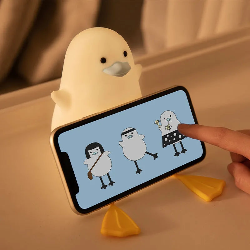 Seagull-shaped silicone night light for babies with soft glow and tap controls