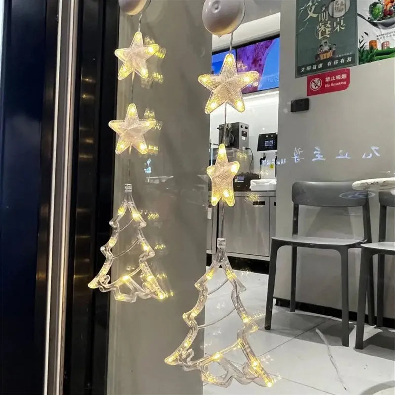 Christmas LED window light with suction cups showing deer, bell, and tree designs