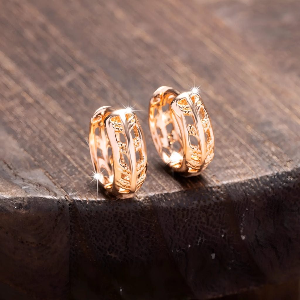 Small copper earrings with hollow heart and leaf shapes in rose gold colour
