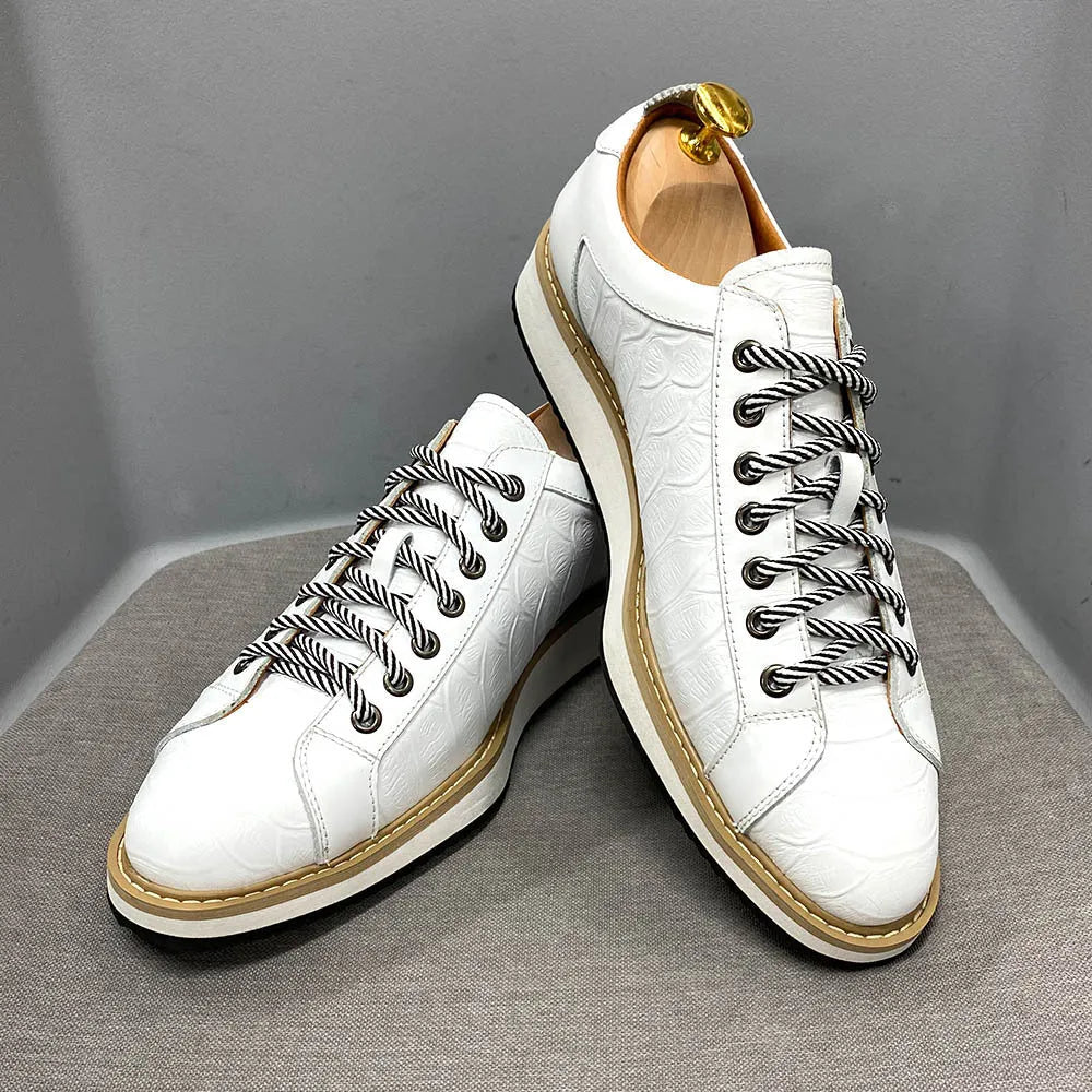 Men's white low-top lace-up shoes with an embossed patterned upper, shown on a plain background.