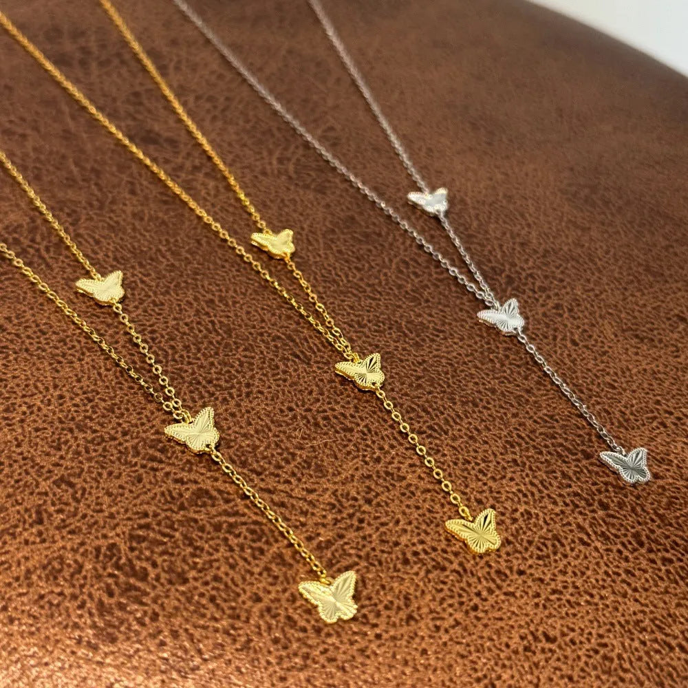 925 silver tassel butterfly pendant clavicle chain in electroplated 14K gold colour on display