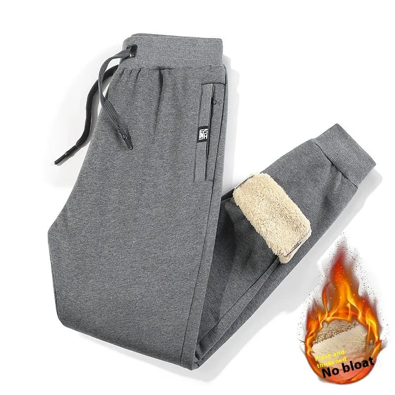Men's grey fleece-lined cotton track pants with oversized fit and micro elastic waist.