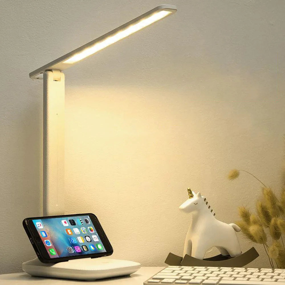 White plastic touch dimming bedside lamp with USB charging port.
