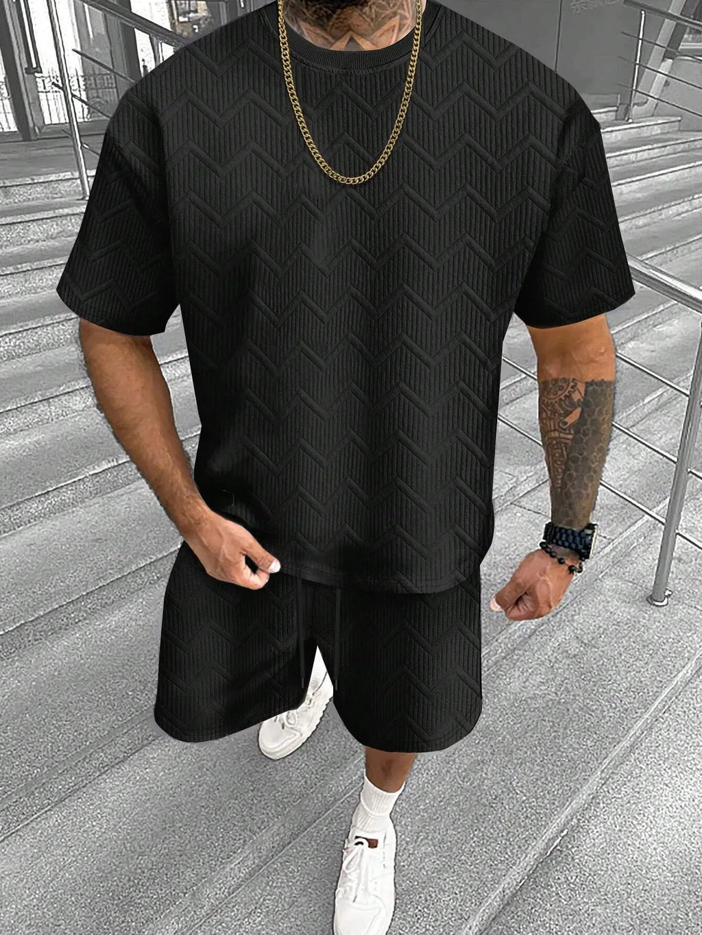Men's short sleeve top and shorts suit in a printed polyester blend fabric.