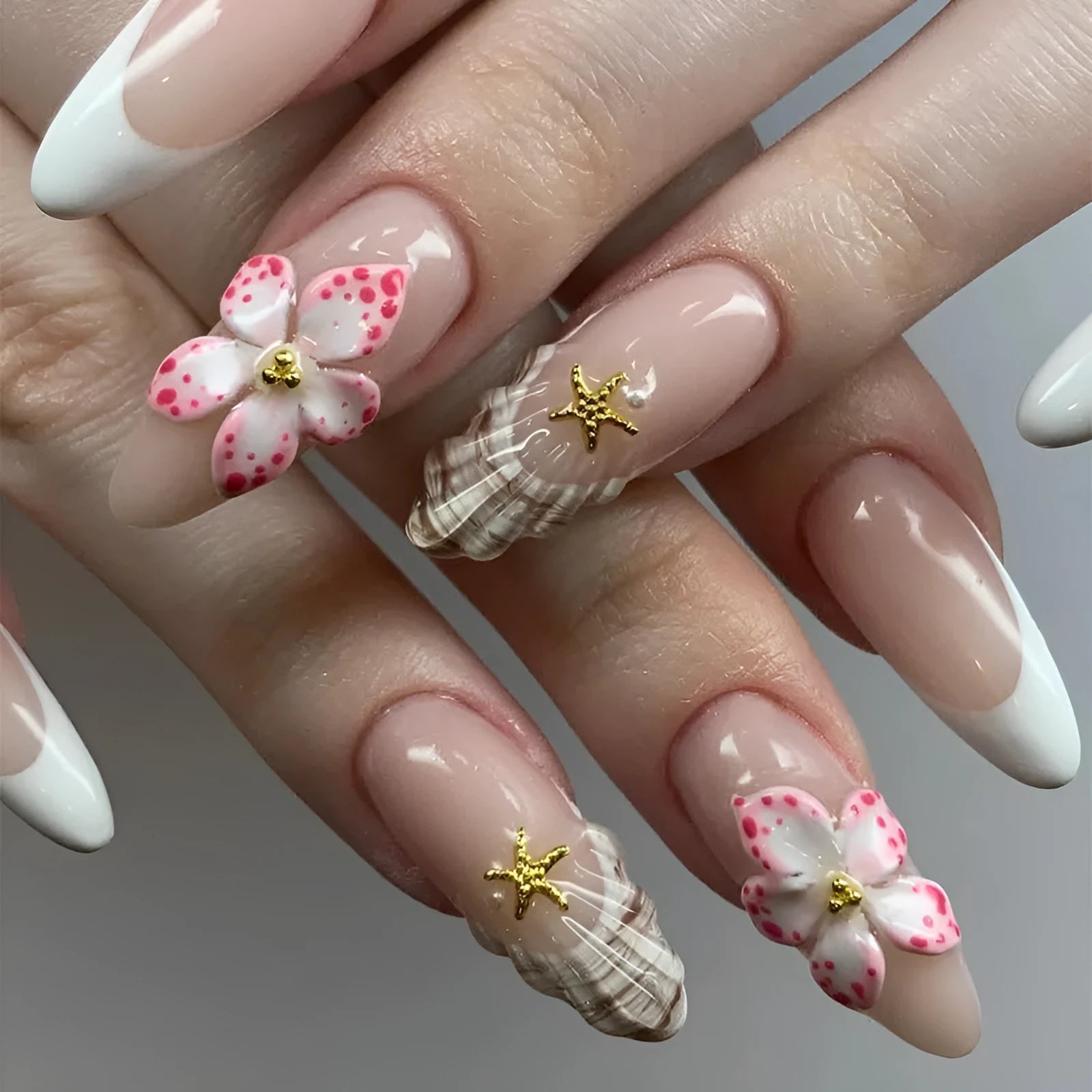 Removable fake nails with simple flower French style and rock pattern patch design in a plastic kit.