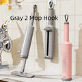 Pink rotatable self-squeeze mini flat mop with microfiber pad, shown extended to its full length.